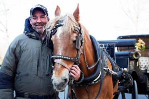 Carriage horse, Roger and his owner, Ian McKeever, pose for one of their final photos in Central Park on Monday, the day before Roger heads to retirement pastures in Syosset. 