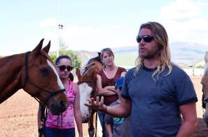 Rupert Isaacson, front, explains the Horse Boy method during a demonstration at the Carbondale rodeo grounds as helpers Zoe Hanlon and Mel Wiley watch.